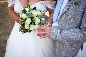 Bride and Groom showing Rings